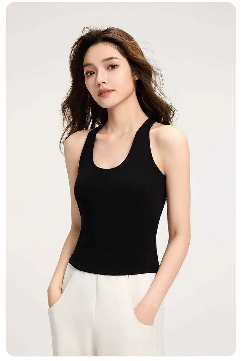 Woman wearing black halter cami top with breathable fabric and built-in bra support