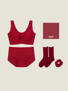 Red lingerie set with socks and a scrunchie on a beige background